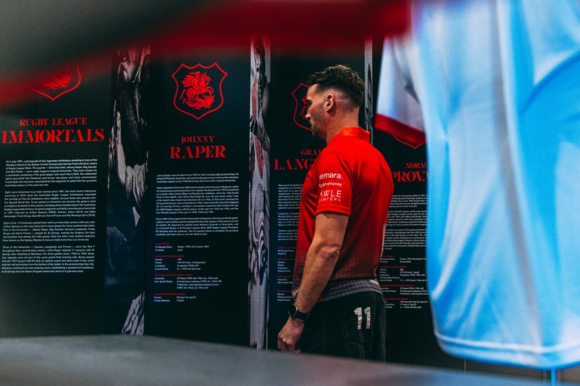 Gutherson examines The Immortals Wall at The Spirit of the Red V Museum.