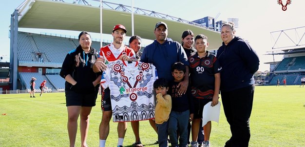 Brendon Garlett explains the 2024 Indigenous jersey design to the playing group