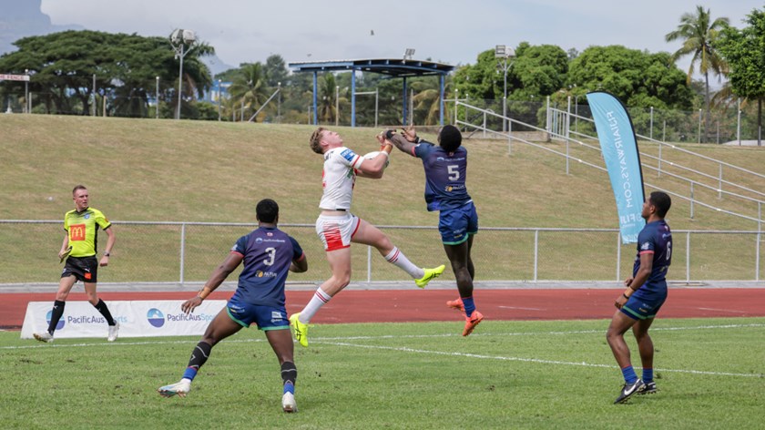 Tom Kirk goes aerial to improve the Red V's lead.